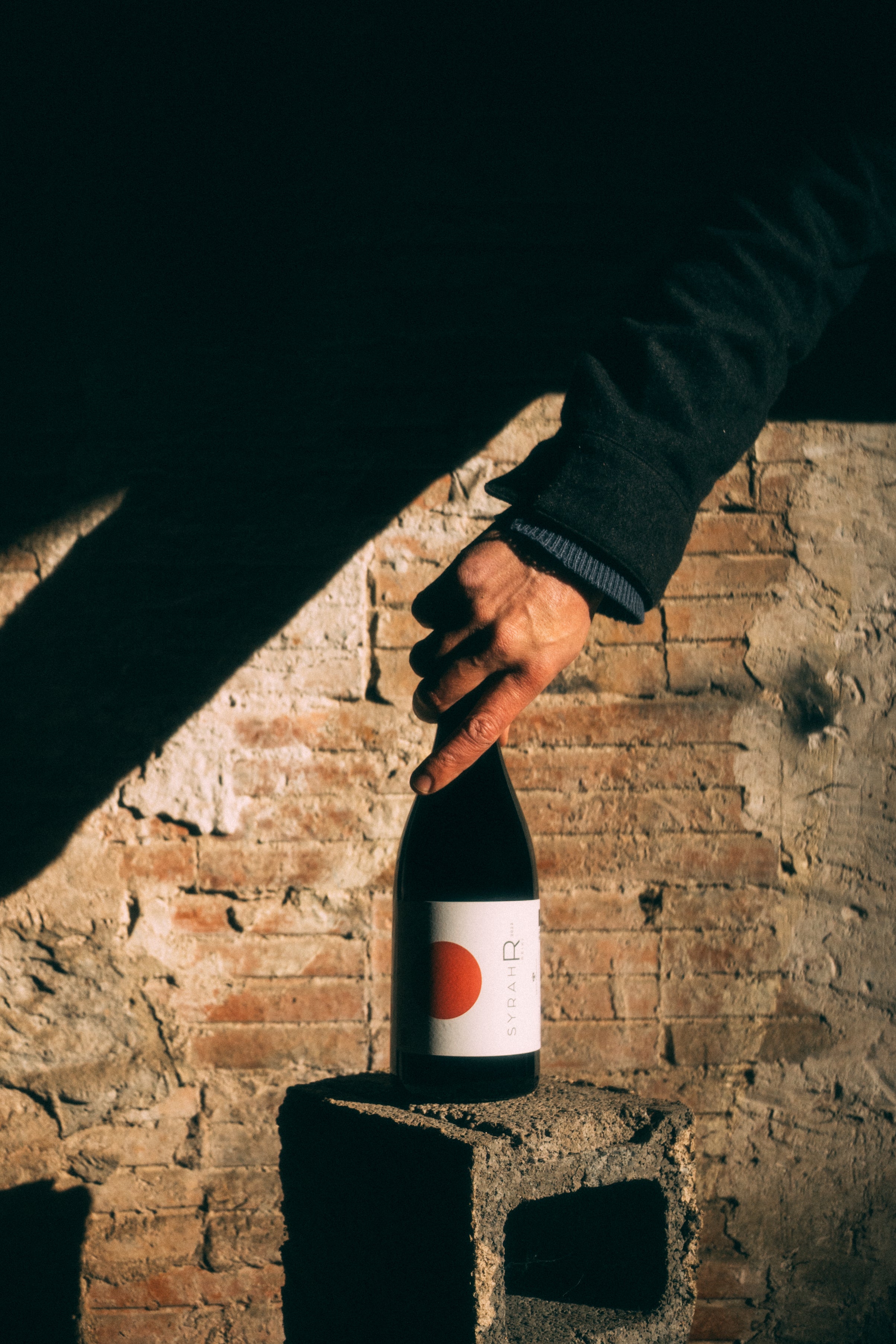 Reiki_Wine_Bottle_Being_Held.